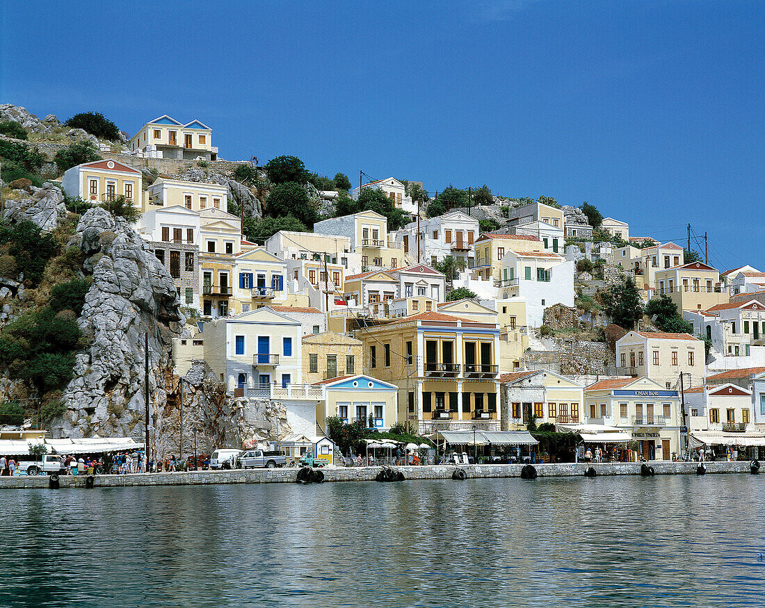 Greece, Simi, Dodecanese, Simi Town, houses at the harbour, houses on a slope