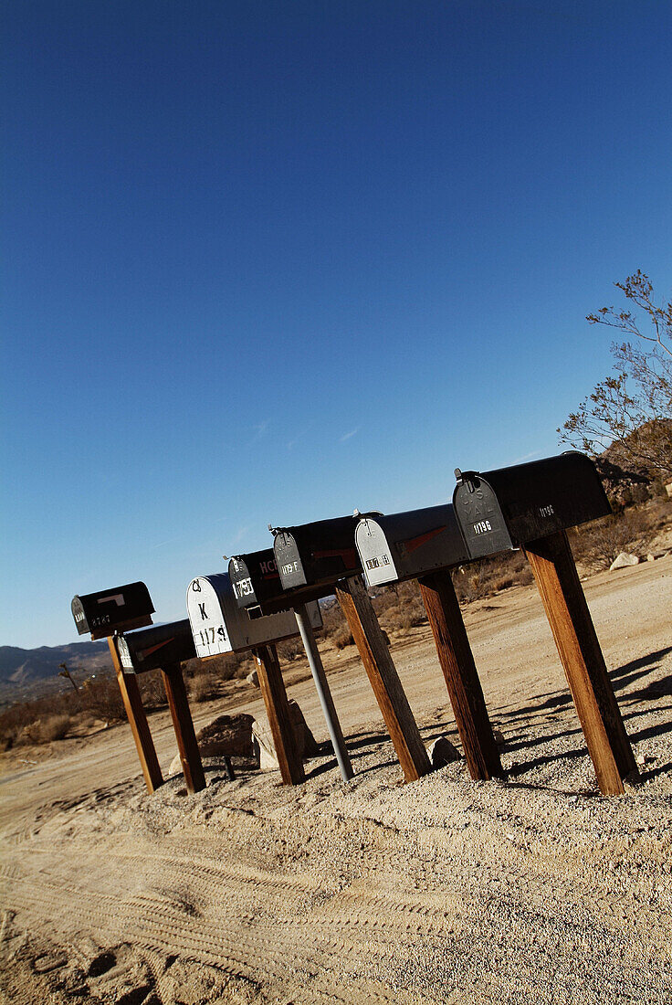  Aged, America, Closed, Color, Colour, Communicate, Communication, Communications, Concept, Concepts, Daytime, Exterior, Lined up, Lined-up, Mail, Mailbox, Mailboxes, Neighbour, Neighbours, Nobody, Old, Outdoor, Outdoors, Outside, Post, Remote, Road, Road