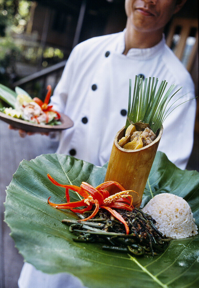 Cheff with local cuisine, Hilton Batang National Park. Sarawak. Borneo. Malaysia