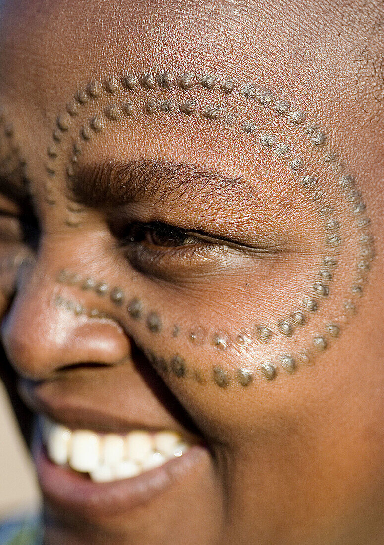 African woman with marks in the skin. Tanzania