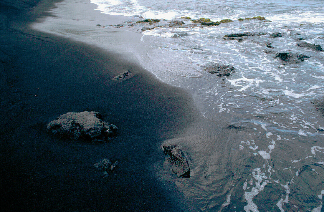 Black sand beach at Punalulu in the Big Island. Hawaii. USA