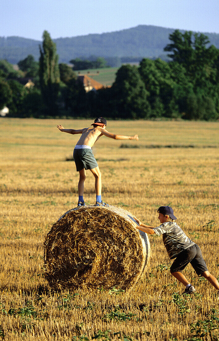 Two boys playing in a field