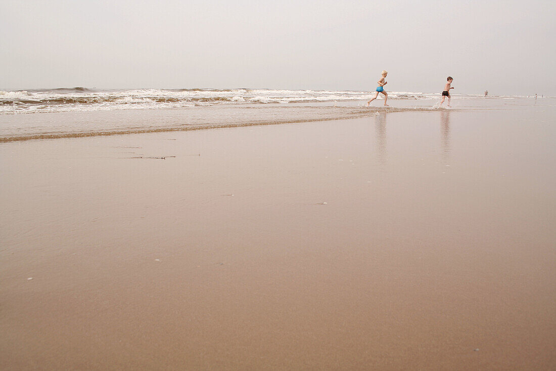 Beach with playing kids