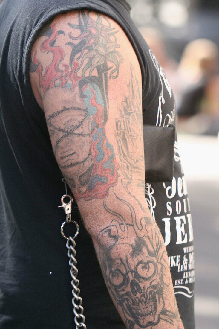 Punk with tatoos of violence on arm, Amsterdam, Holland, Netherlands