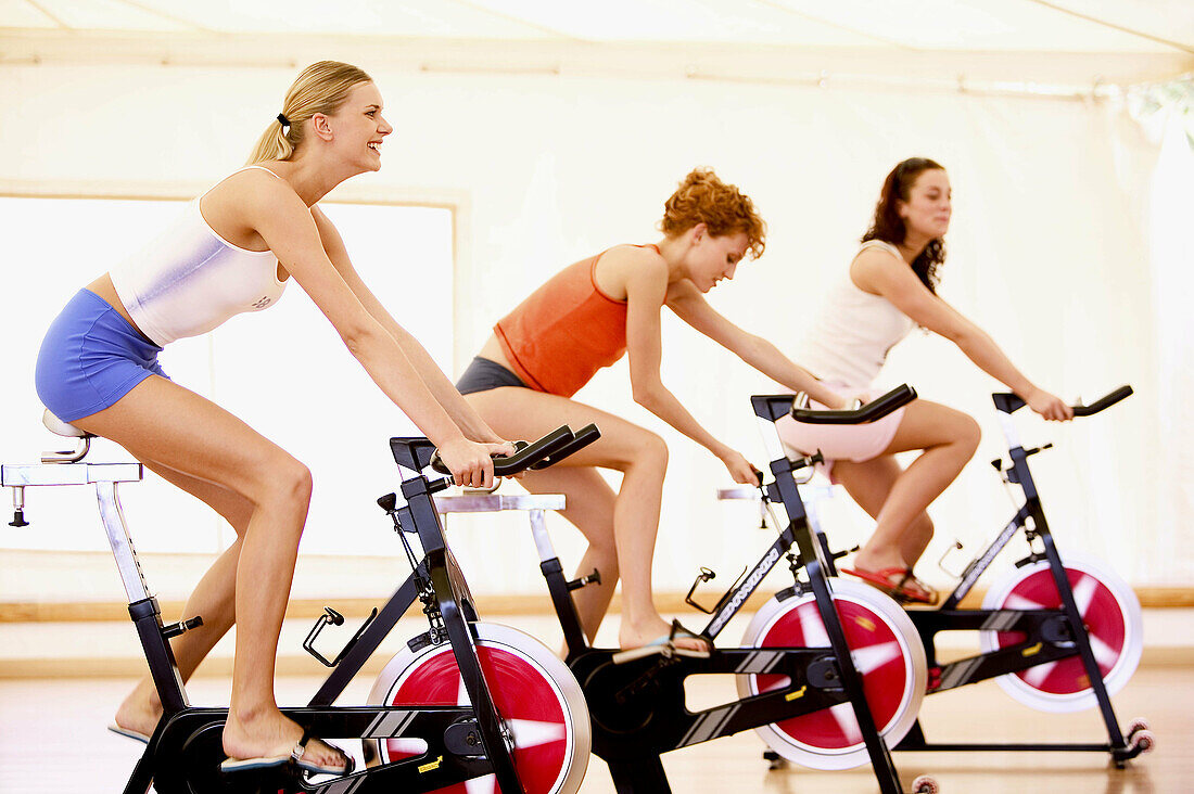 Activity, Adult, Adults, Body, Color, Colour, Contemporary, Cycle, Cycles, Dynamism, Exercise, Exercise bicycle, Exercise bicycles, Exercise bike, Exercise bikes, Female, Fit, Fitness, Gym, Gymnasium, Gymnasiums, Gyms, Human, Indoor, Indoors, Interior, Ma