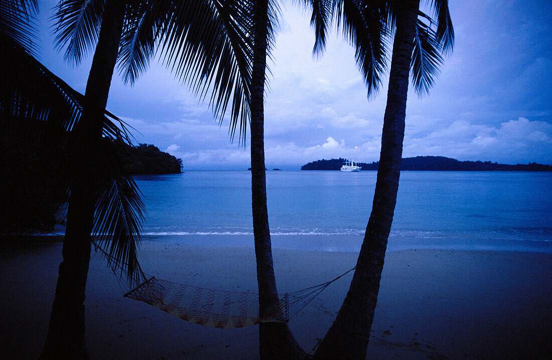 Tropical beach, palms and hamock. Coiba Island National Park, Coiba Island, Panama