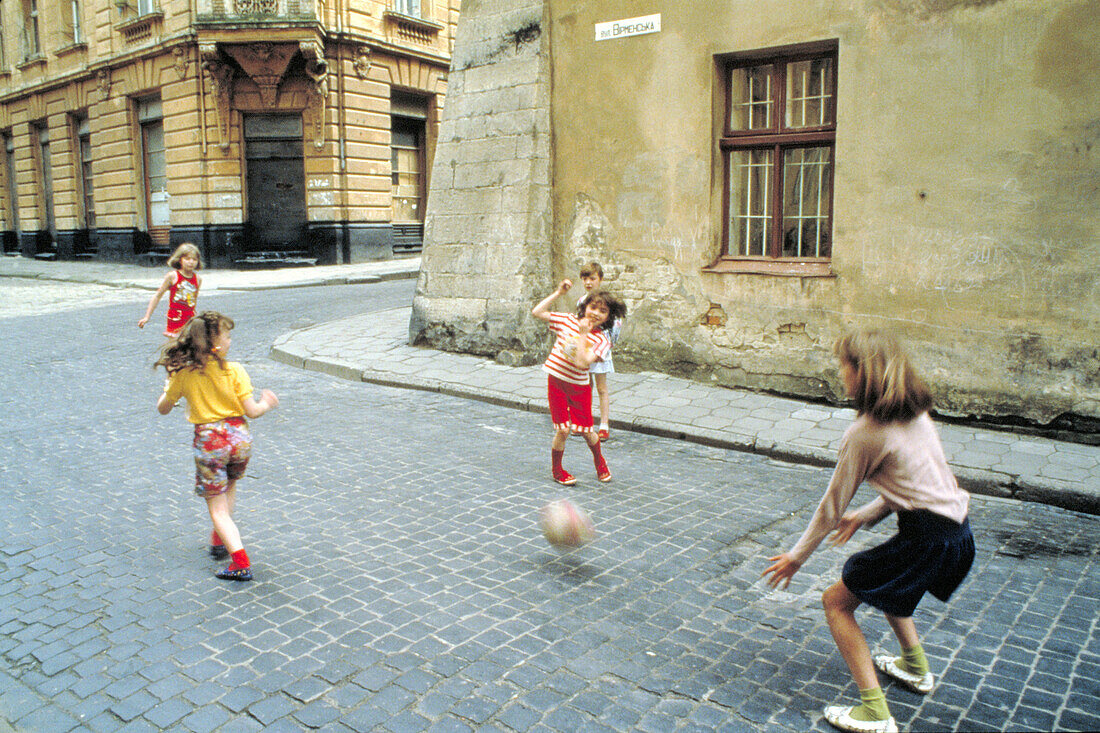 Little girls playing in the street. Lviv. Ukraine