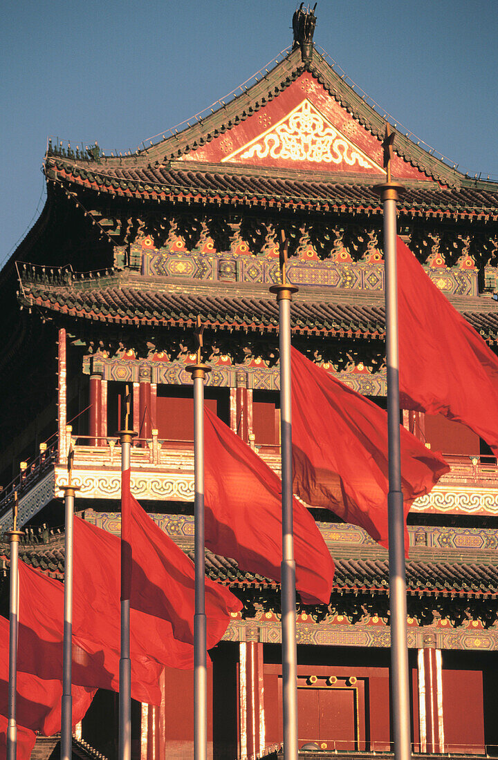 Zhongyang Tower and red flags. Tiananmen Square, Qianmen (Front Gate). Beijing. China