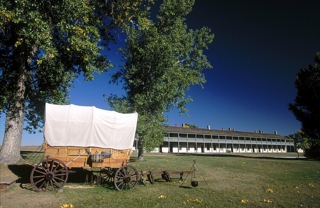 Cavalry barracks and wagon. Old West Army Outpost (c. 1849). Fort Laramie National Historic Site. Wyoming. USA