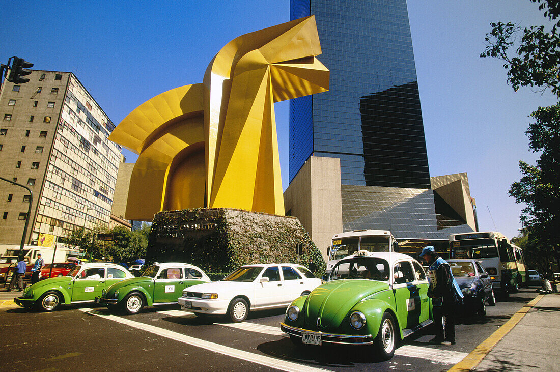 Torre Caballito, taxis and sculpture at Paseo de la Reforma avenue. Mexico City. Mexico