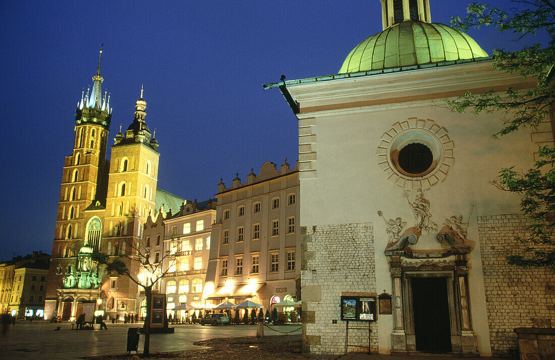 Kosciol Mariacki (St. Mary s Church, B.1220) and Kosciol sw Wojciecha (St. Adalbert’s Church). Rynek Glowny. Krakow. Poland