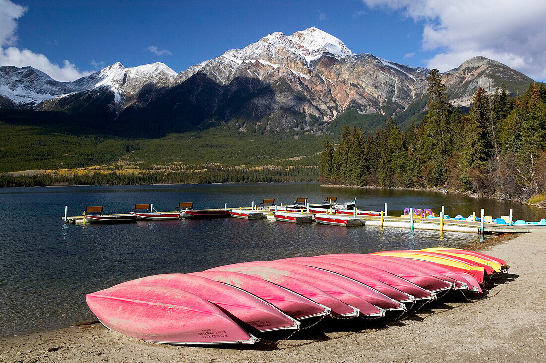 Rental boats at Pyramid Lake and Pyramid Mountain (2762 m) in background. Jasper National Park. Alberta, Canada