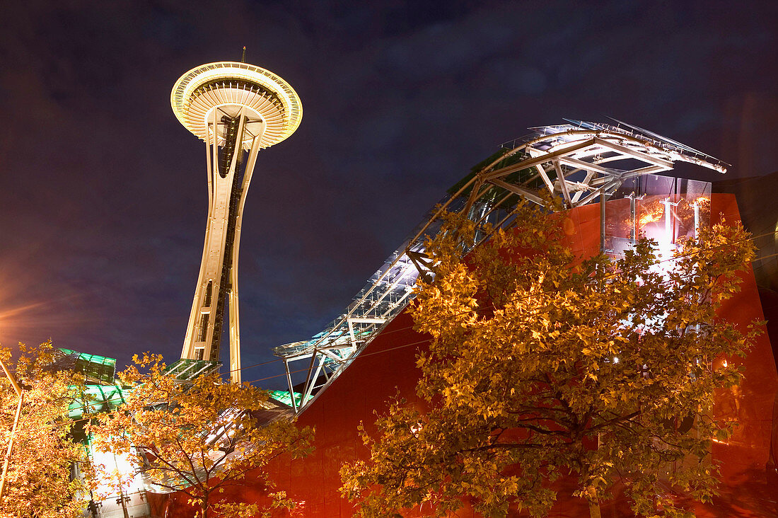 Experience Music Project (interactive music museum built by Frank O. Gehry) with Space Needle at evening. Seattle. USA