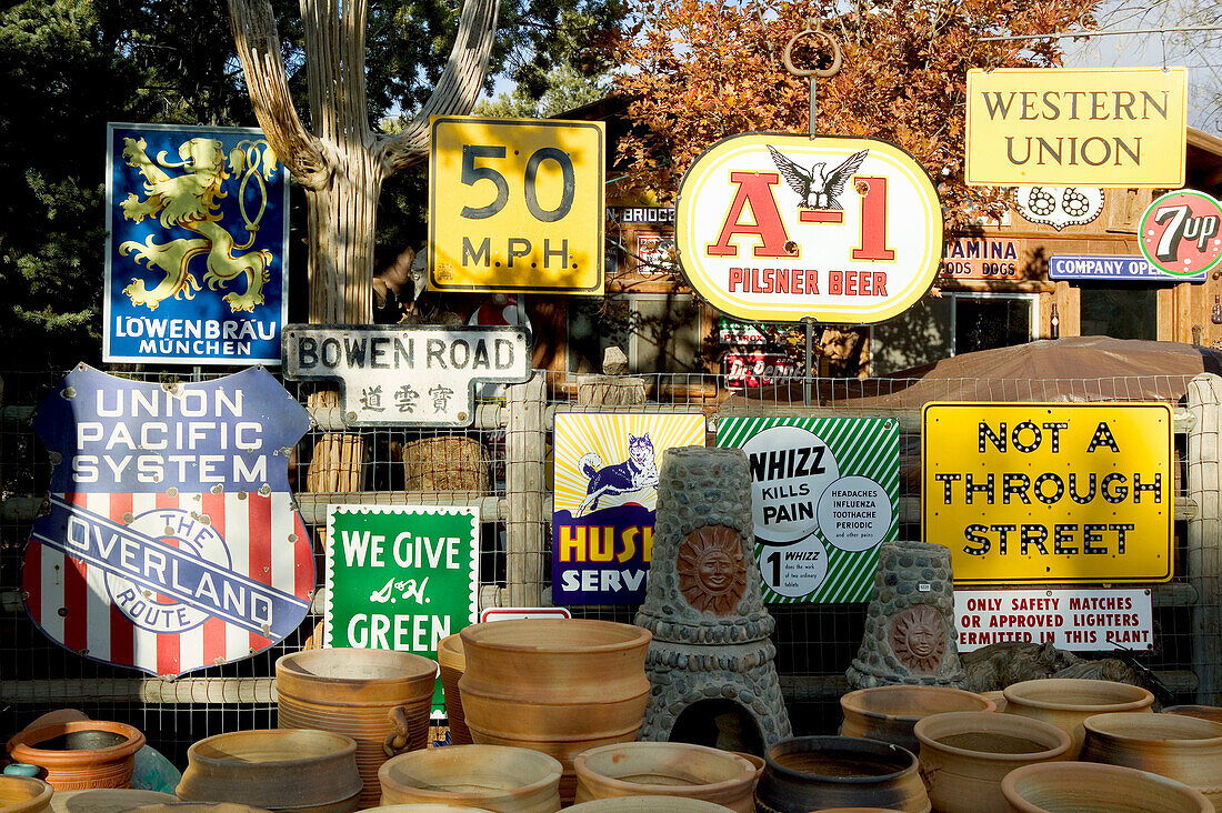 Antique advertising signs at antique and crafts market. Sedona. Arizona, USA
