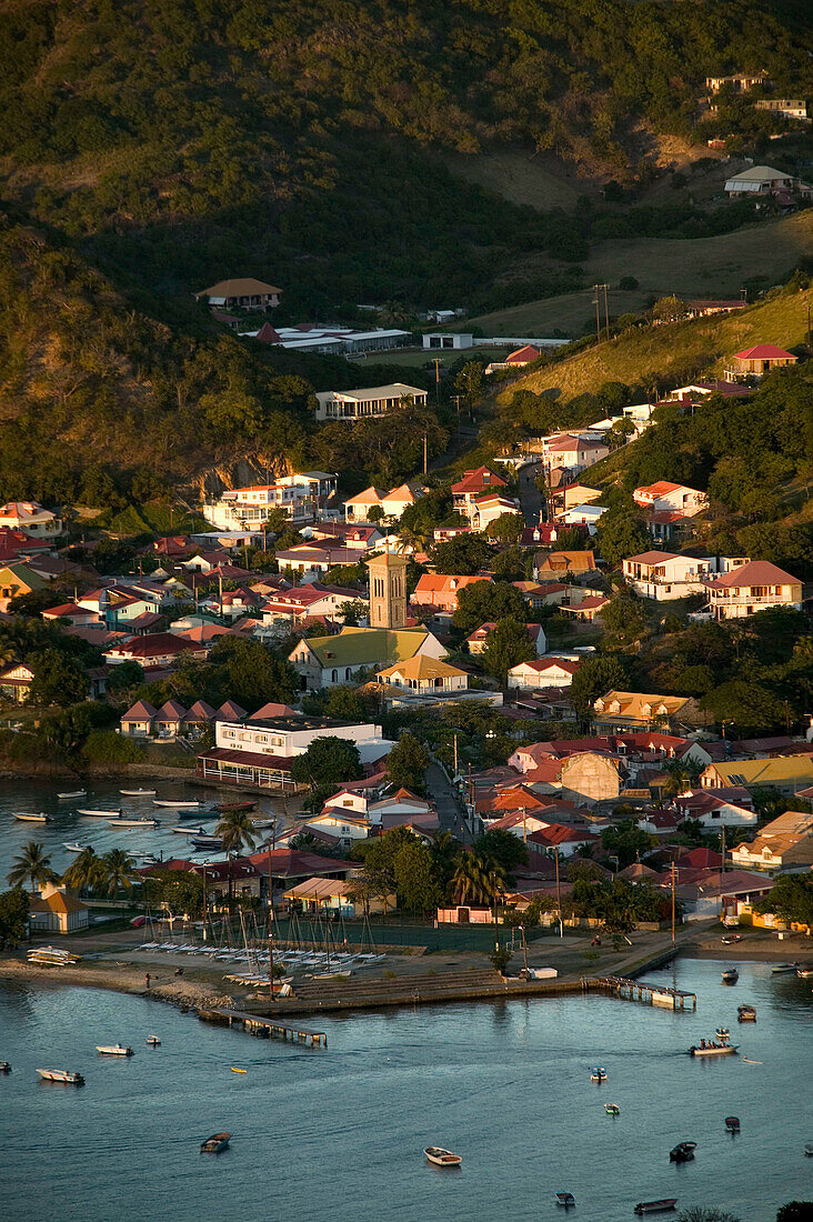 French West Indies (FWI), Guadeloupe, Les-Saintes Islands, Terre-de-Haut: Bourg Des Saintes. Town from Le Chameau Peak (309 meters) / Sunset