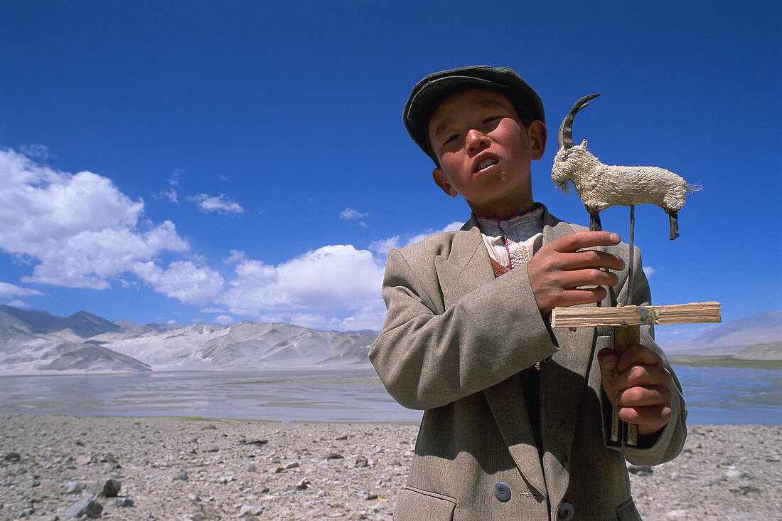 Kirgiz boy. Lake Karakul. Karakoram Highway