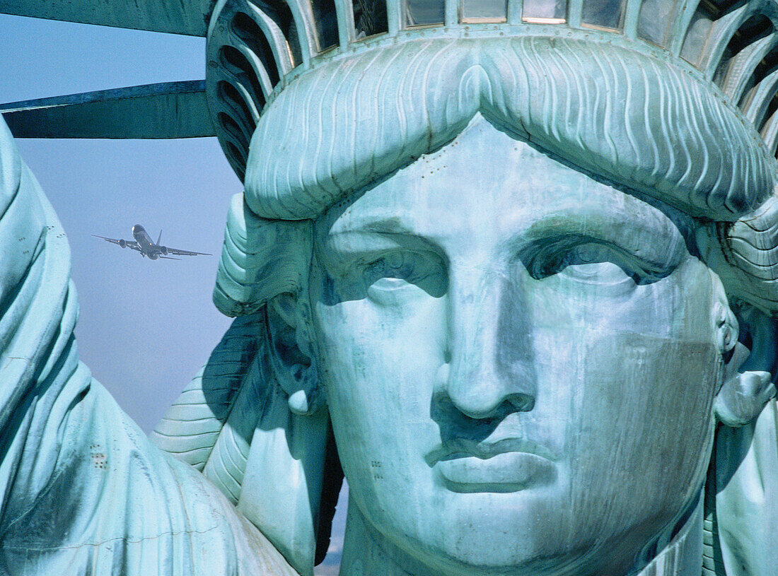 Statue of Liberty with plane. New York City. USA