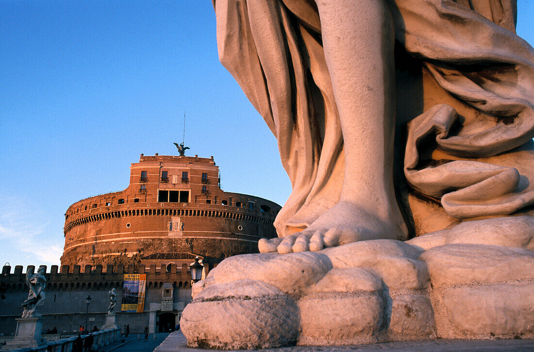 Sant Angelo Bridge angel by Bernini. Castle at rear. Rome. Italy