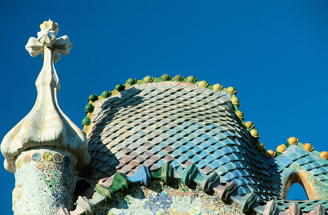Casa Batllo by Gaudi, detail of roof and tower (1904-1906). Barcelona. Spain