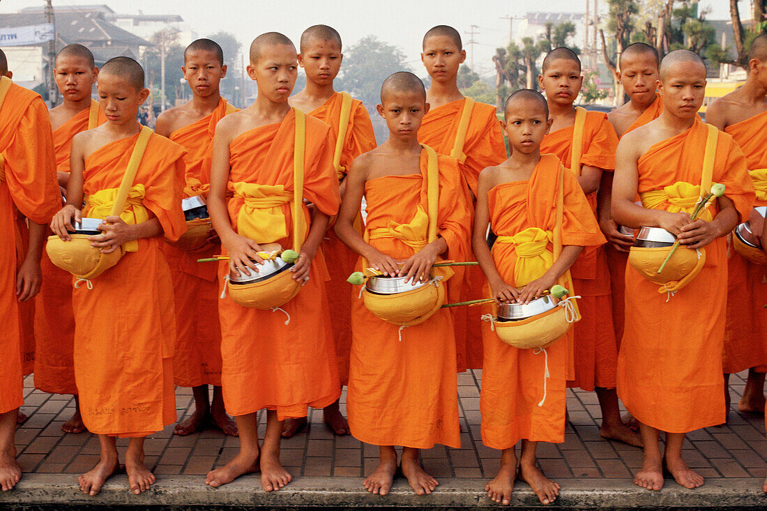 Buddhist Monks. First morning of Thai New Year. Chiang Mai. North Thailand