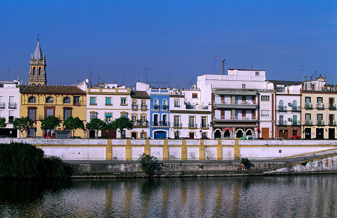 Old quay in the Guadalquivir River passing by the popular quarter of Triana. Seville. Andalucia. Spain