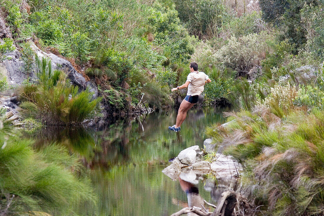 Man jumping into water at Grabouw Forest Park, near Cape Town, South Africa, Africa, mr