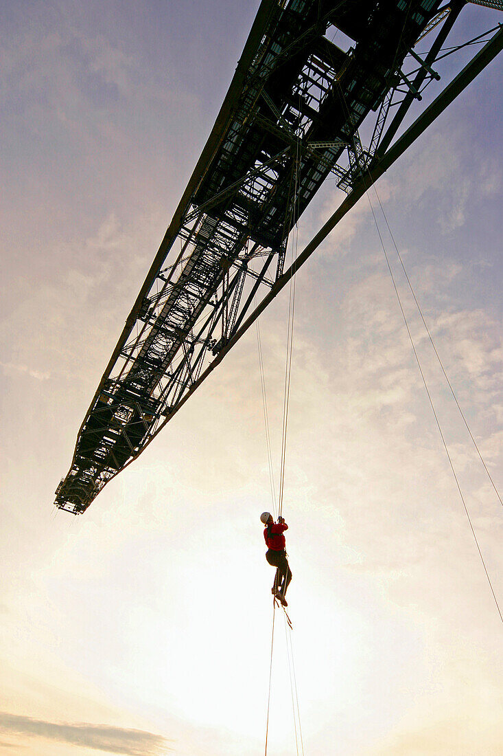 Person climbing on an overburden conveyor bridge F 60, Mining Exhibition, Lichterfeld, Brandenburg, Germany