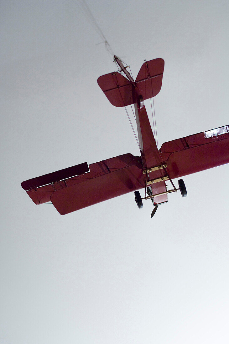 A red model airplane flying, Toy