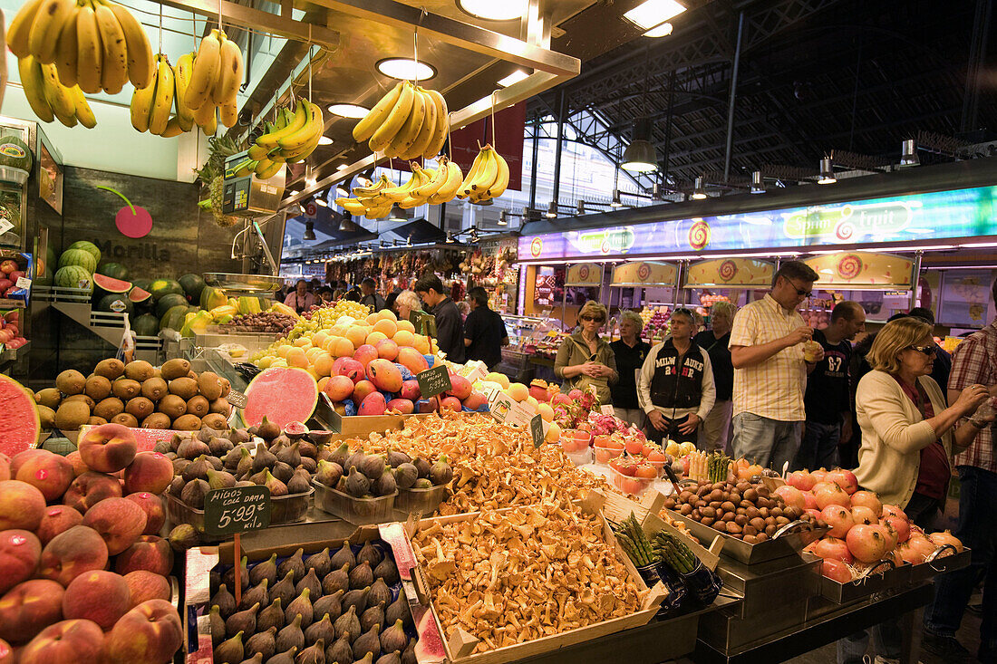 Barcelona,market hall La Boqueria,fruit and vegetable stall,people