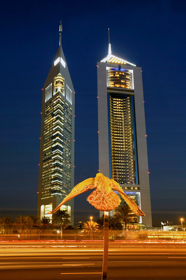 Dubai Sheikh Zayed Road skyscraper , Emirates towers, skyline , sculpture of a falcon