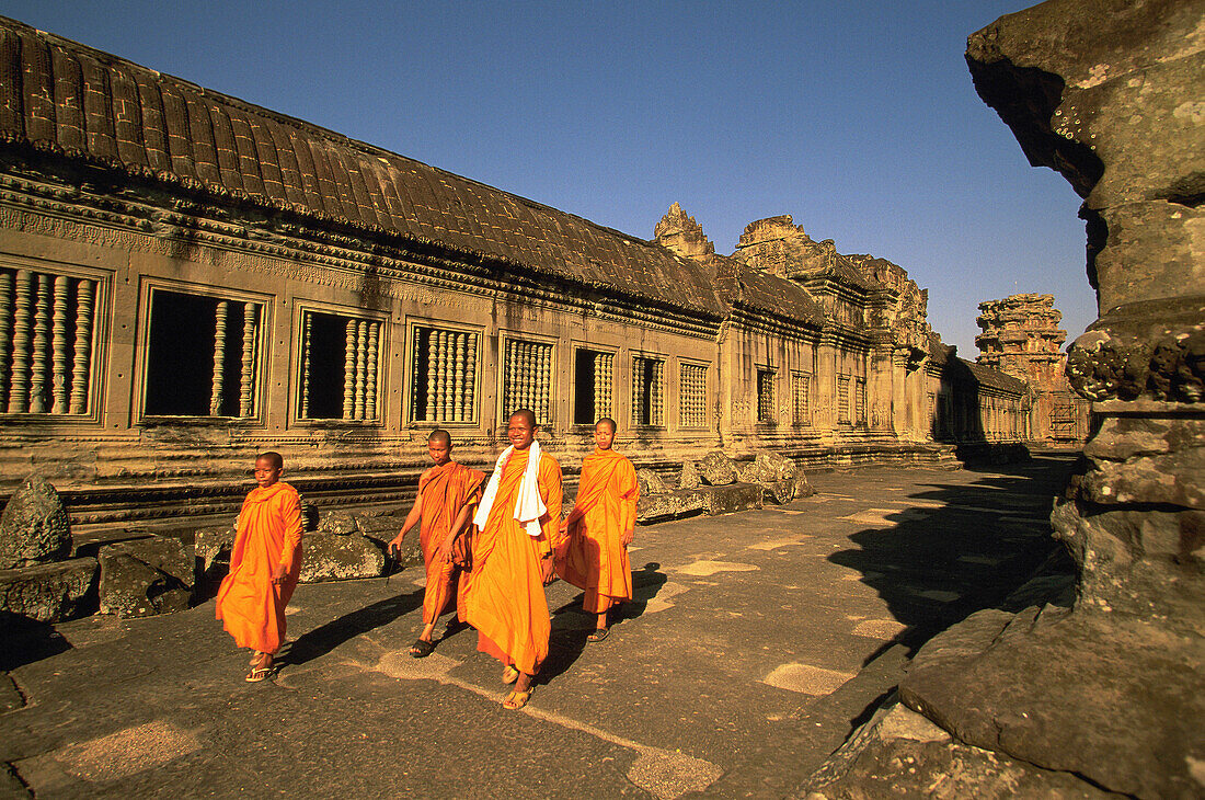 Monks at the temple complex of Angkor Wat. Angkor. Cambodia