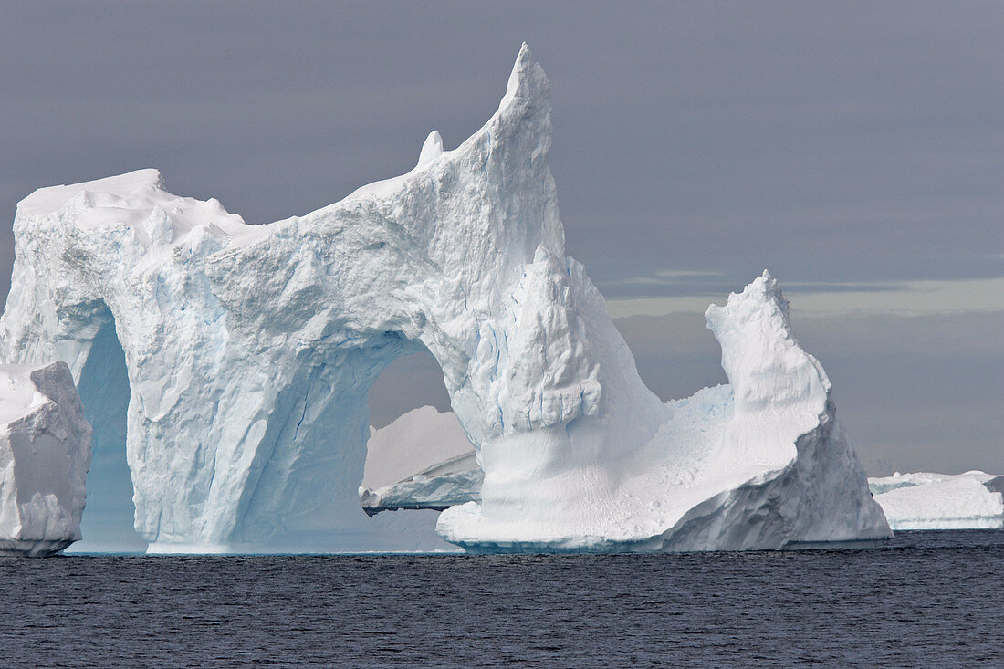 Double iceberg arch. Antartic Peninsula