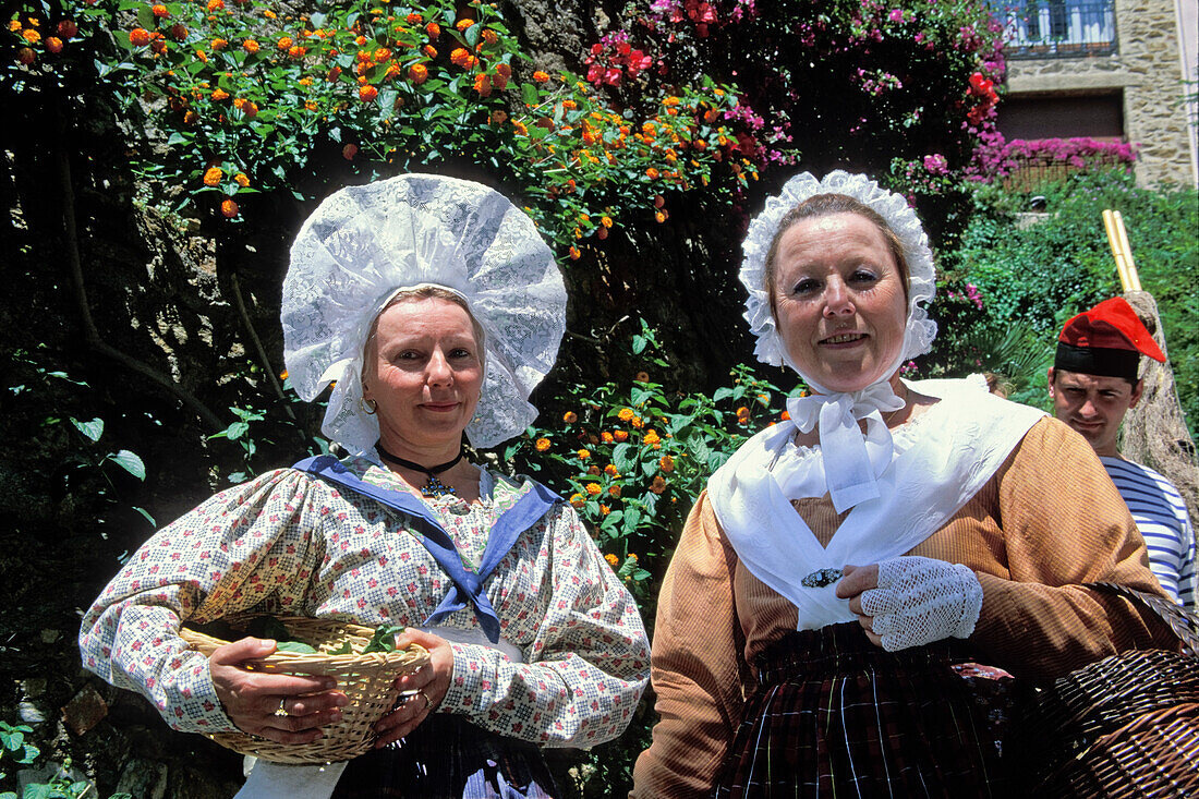 women in provencal costumes, Bormes-les-Mimosas, Provence, France, Europe