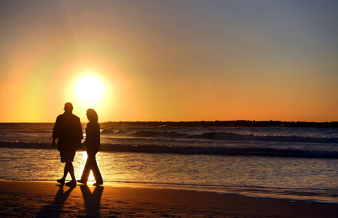 Couple in romantic sunset on the Mediterranean, Tel Aviv, Israel