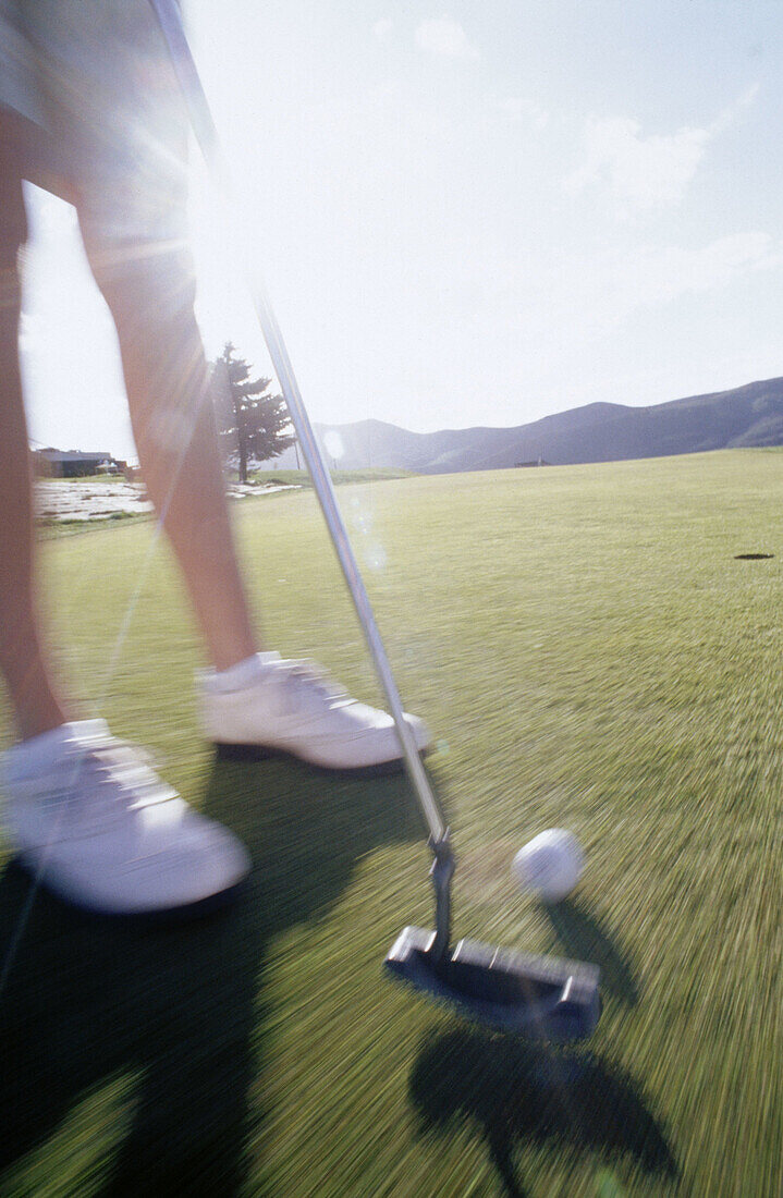  Ball, Balls, Blurred, Close up, Close-up, Color, Colour, Concept, Concepts, Contemporary, Daytime, Detail, Details, Exterior, Golf, Golf club, Golf clubs, Golf course, Golf courses, Golfing, Grass, Green, Human, Lawn, Leg, Legs, Leisure, Motion, Movement