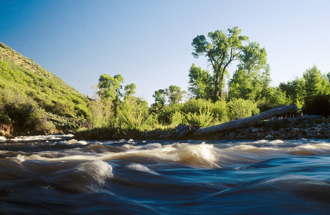 USA. Utah. Time exposure of Provo River flowing through Francis
