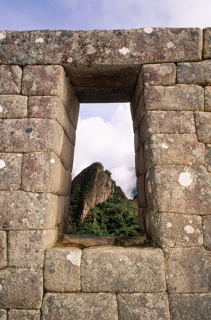 Ruins viewed through a doorway. Machu Picchu. Peru