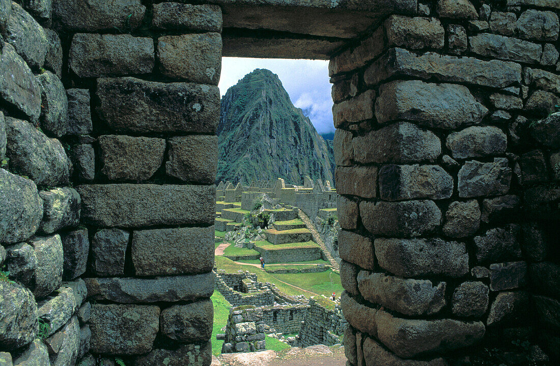 Ruins viewed through a doorway. Machu Picchu. Peru