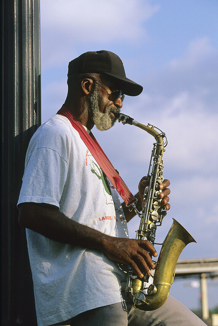 Musician playing on boat on Mississippi river, New Orleans. Louisiana, USA