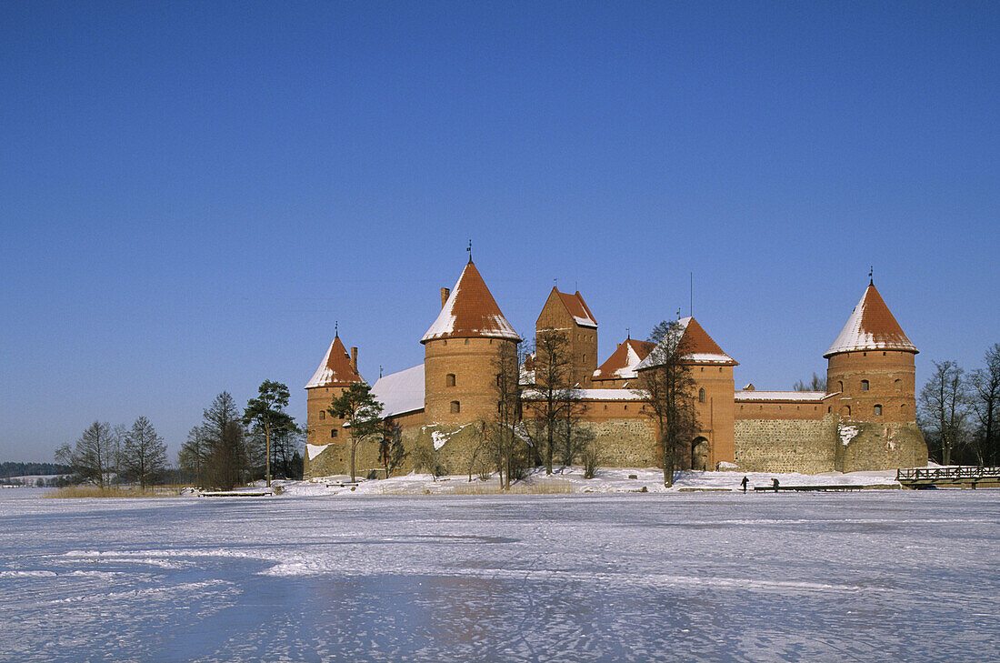 Gothic castle built XIV-XVth century, Lake Galve in winter. Trakai, Lithuania