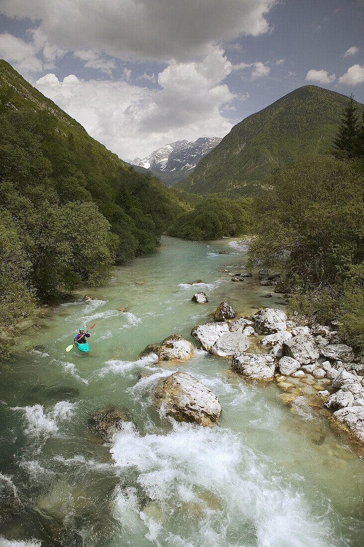 Turquoise Waters of the Soca River. Julian Alps with Kayaker. Soca. Primorska. Slovenia.