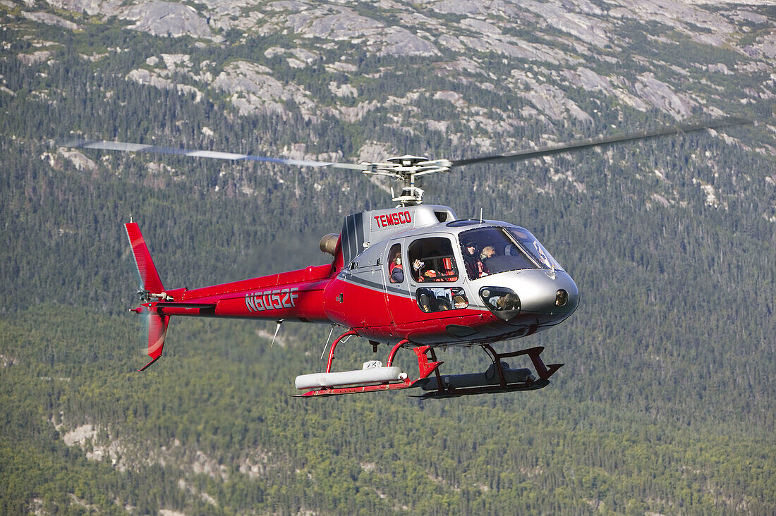 Temsco Helicopter taking tourists on Glacier Tours. Skagway. Southeast Alaska. USA.