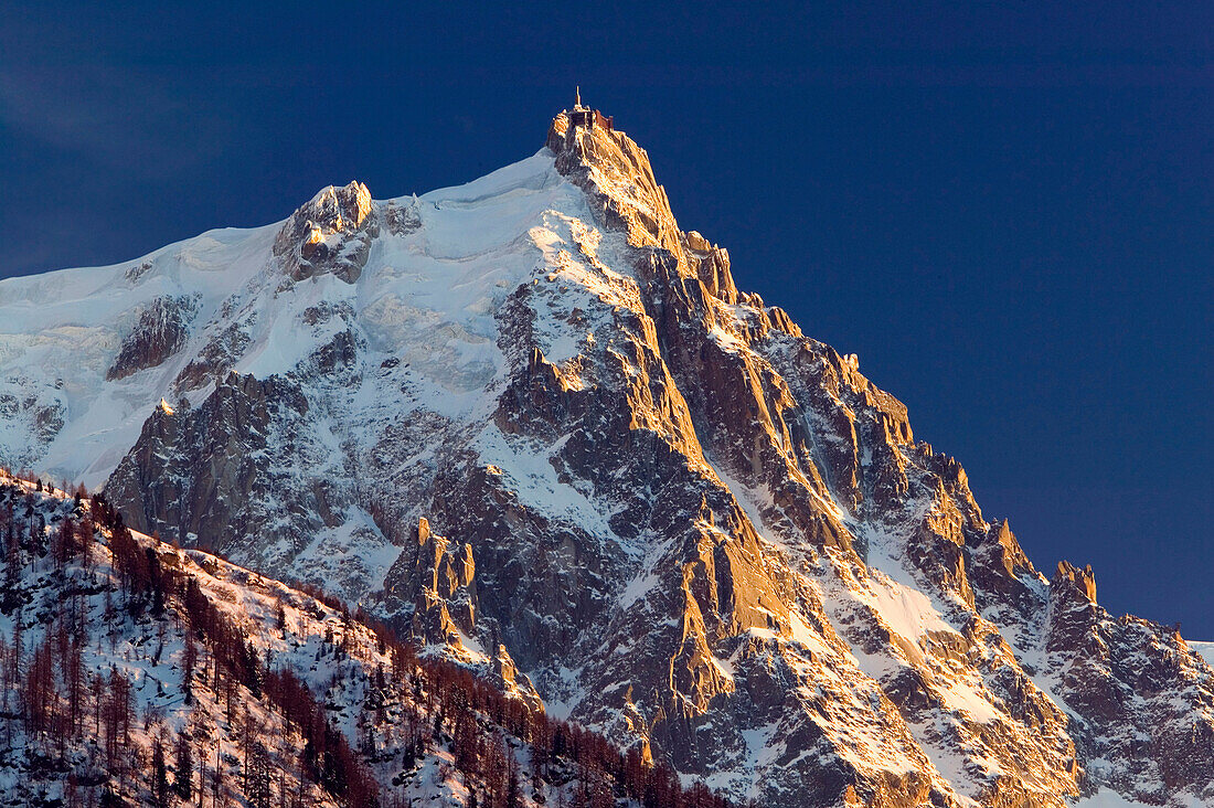 View towards Aiguille du Midi Peak (elev.3800 m/12,467Ft) at Sunset/ Winter. Chamonix. Mont-Blanc. Haute-Savoie. French Alps. France.