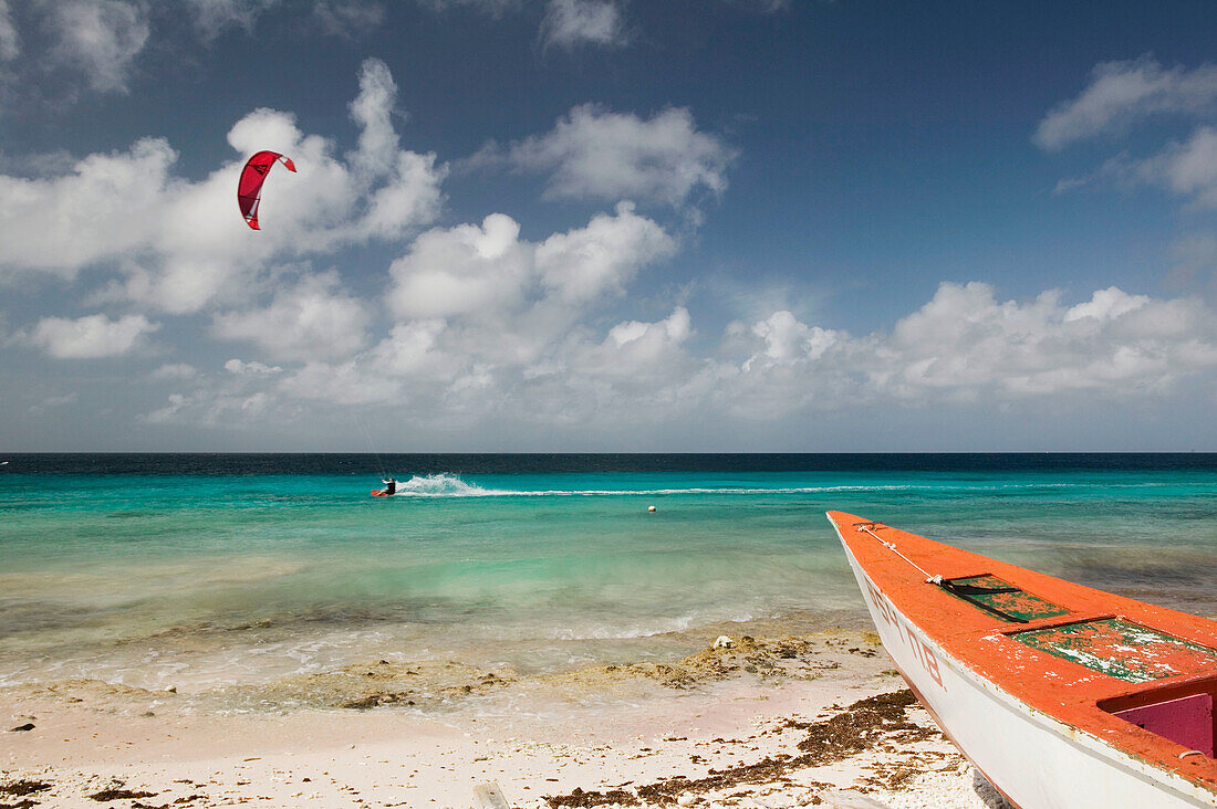 Beach View with Fishing Boat & Kite Surfer. Pink Beach. Bonaire. Netherlands Antilles.