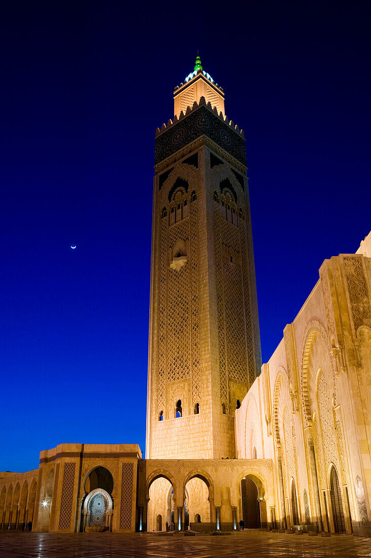 Morocco-Casablanca: Hassan II Mosque (b.1993)-Exterior / Evening. Holds 25,000 Worshipers and the minaret is 210m tall-The Tallest Minaret in the world!