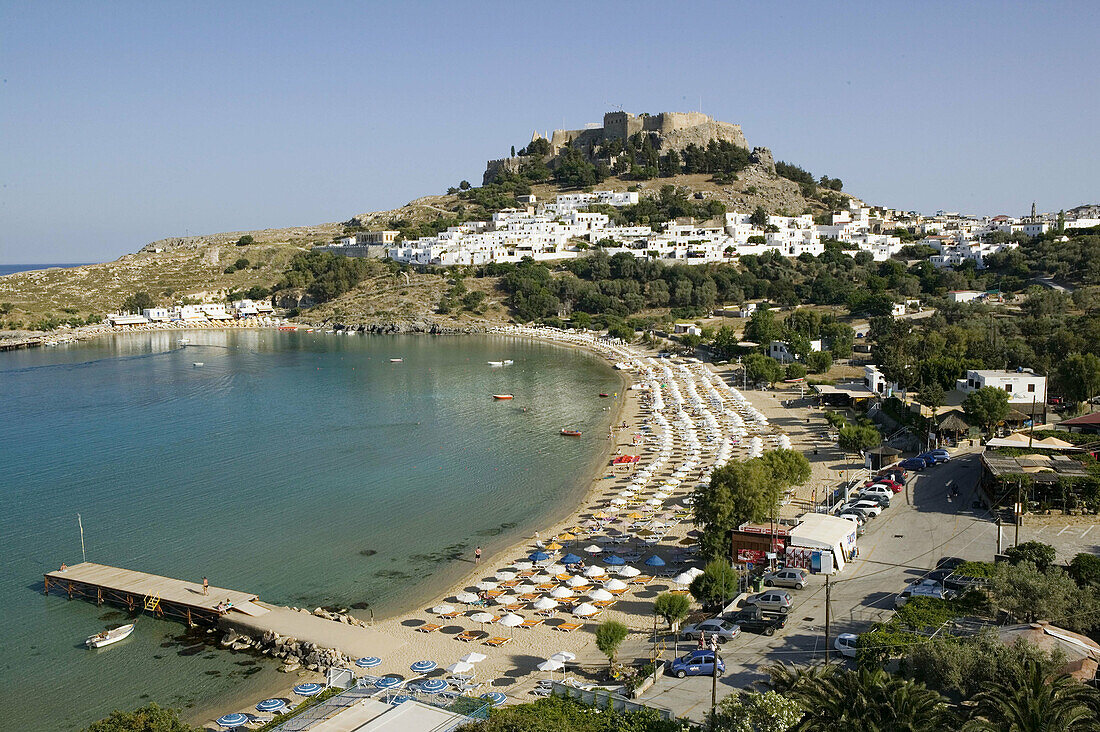 Harbor. Beach view with Acropolis of Lindos. Late Afternoon. Lindos. Rhodes. Dodecanese, Greece