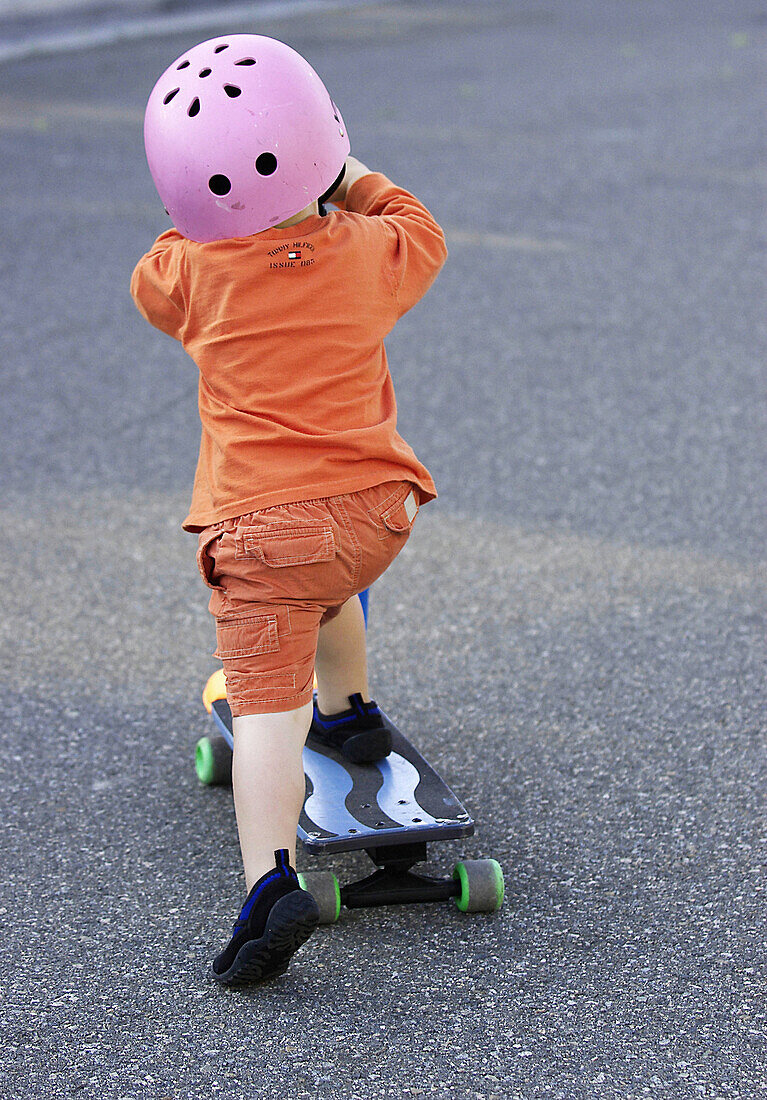 Toddler on skateboard