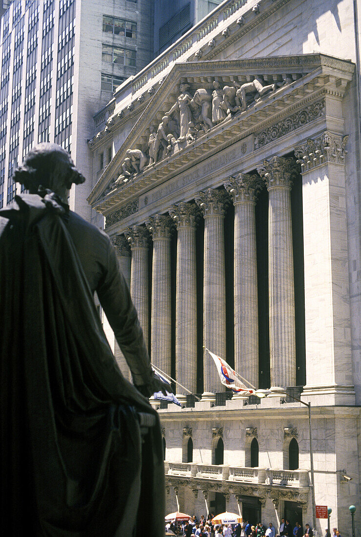 Washington Monument and Stock Exchange building, Wall Street, financial district. Manhattan, New York City. USA