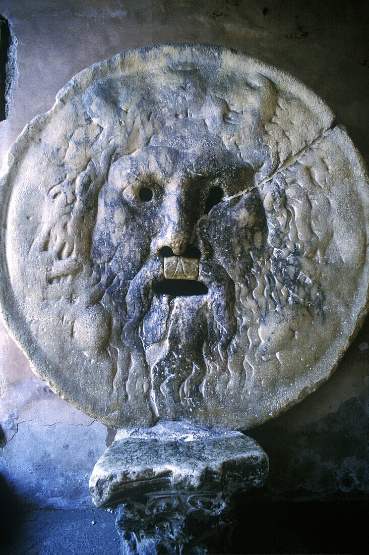 Bas-relief known as Mouth of Truth according to an old legend, in the porch of Santa Maria in Cosmedin church. Rome. Italy