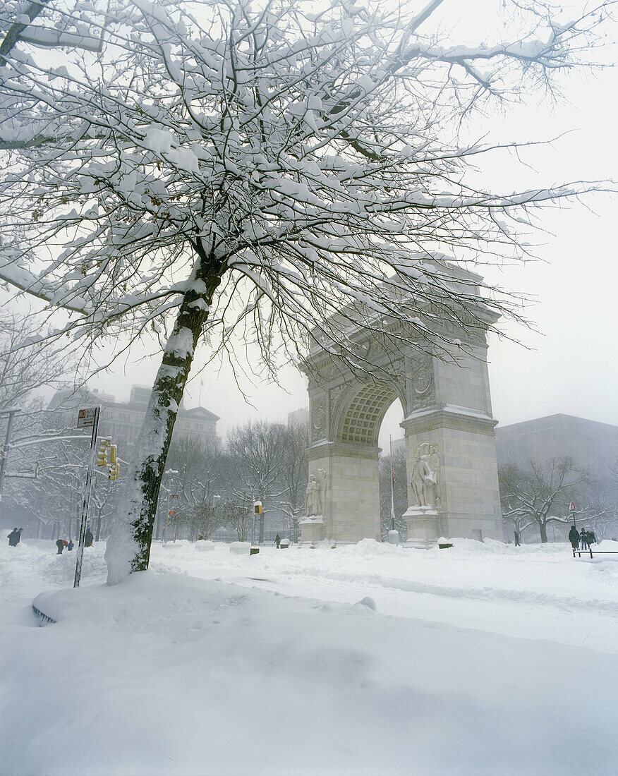 Snow-covered Washington Arch in Washington Square Park, Manhattan, NYC. USA